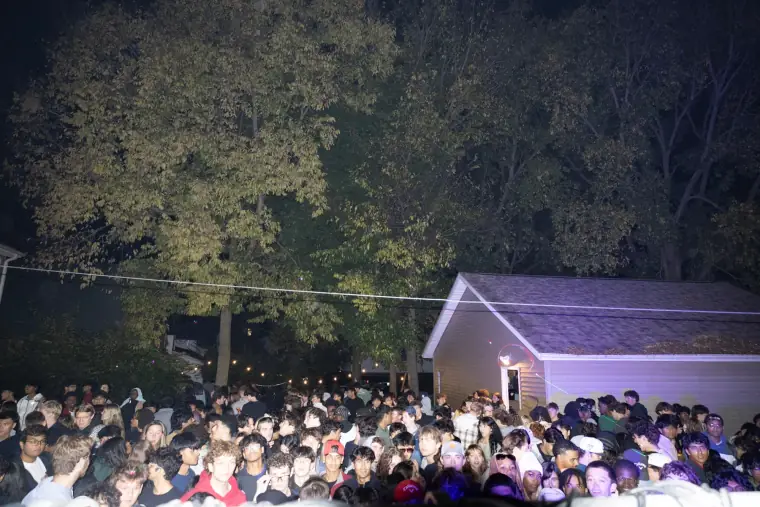Outdoor crowd gathered at night